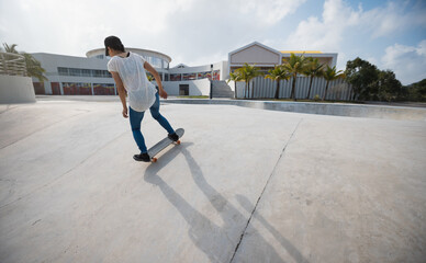 Wall Mural - Skateboarder skateboarding at skatepark in city