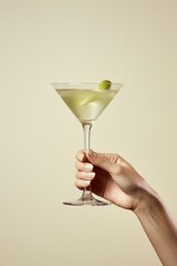 Canvas Print - Martini cocktail holding drink glass.