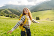 © maxbelchenko - Happy Woman tourist admiring the landscape mountains nature. Exploring wilderness in National Park. Travel, hiking concept.