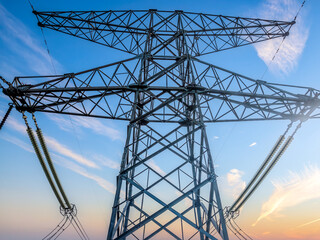 High voltage electricity towers at dusk