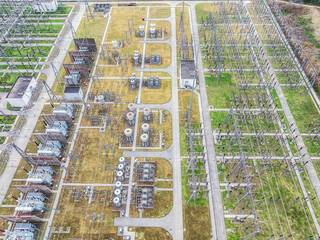 Canvas Print - Aerial view of high voltage substation electricity tower industrial equipment landscape