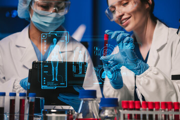 Wall Mural - team of biochemical research scientists working with a microscope for vaccine development