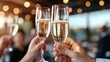 © Pinklife - Two champagne glasses are raised in a toast in bright daylight with bokeh lights in the background, expressing joy, celebration, and togetherness.
