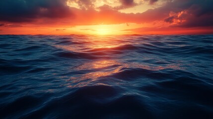 Poster - The ocean is calm and the sun is setting, creating a beautiful