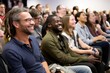 © Rawpixel.com - Audience performance sitting smiling.