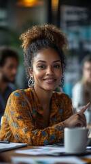 Poster - A woman with a smile on her face is sitting at a table with a cup in front of he