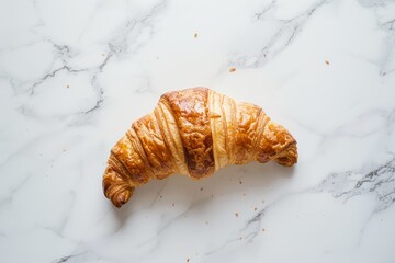 Freshly baked croissant on marble surface