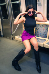 Fashion Girl With Glasses On A Subway