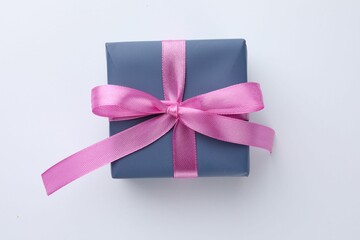 Wall Mural - Beautiful gift box with pink bow isolated on white, top view