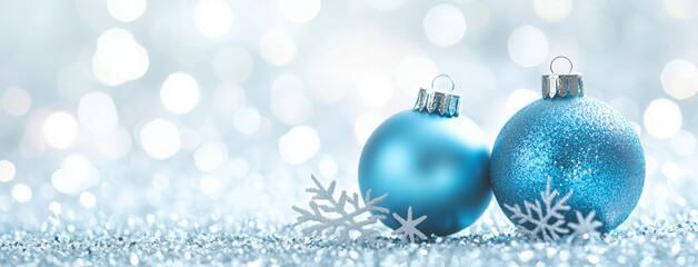 Wall Mural - two blue christmas ornaments with snowflakes on the ground