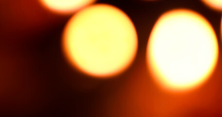 Abstract blurred warm glowing light bokeh circles background. Closeup