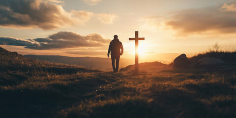 Wall Mural - Man walking towards cross on hilltop at sunset