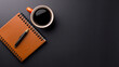 © Hamid - A cozy workspace featuring a cup of coffee beside an open notebook and pen on a wooden desk, perfect for business notes or enjoying a relaxed breakfast