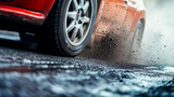 detailed shot of a rally car vehicle's tire in motion, throwing dirt and gravel during a high-speed race