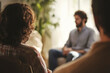 © Lazy_Bear - Couple at psychologist's appointment talks about problems. Man and woman sitting on couch and talking to specialist during therapy session