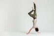 © Rawpixel.com - Teenage man handstand dancing sports yoga.