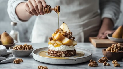 Wall Mural - A chef's hand drizzles honey over a dessert made with pear, walnuts, and cream cheese.