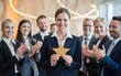 © Shivamrajput46  - A team leader holding a gold star award while team members cheer and applaud in a vibrant office setting, Customer Experience Concept, Best Excellent Services for Satisfaction present by Hand of Clien