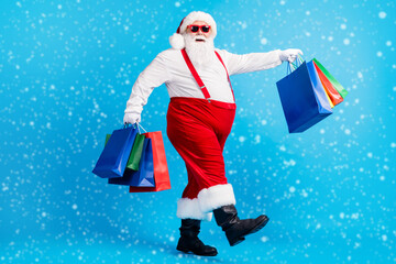 Wall Mural - full length profile side photo of crazy modern white grey hair bearded santa claus go shopping buy x