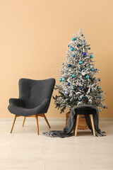 Canvas Print - Beautiful Christmas tree with armchairs near beige wall