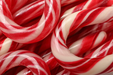 Wall Mural - Texture of tasty Christmas candy canes as background, closeup