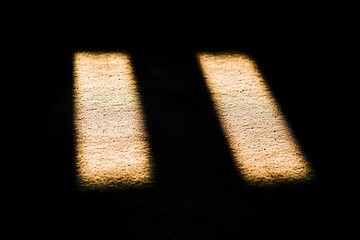 Poster - Soft Light Spots on a Dark Surface Create a Striking Visual Contrast in a Serene Setting