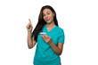 © PeopleVideos - Portrait of a young nurse in scrubs using a smartphone