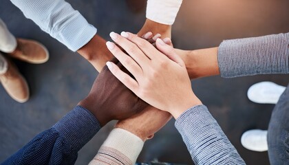 a group of people with their hands in the middle and stacked on top of each other's hands; a team hu