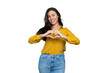 © PeopleVideos - Portrait of a young businesswoman making a heart sign with her hands