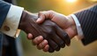 © SEYYAH - Two business professionals shaking hands outdoors in a city, symbolizing partnership and collaboration in a corporate environment