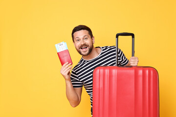 Sticker - Happy man with passport, tickets and suitcase on orange background