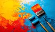 © Александр Михайлюк - A paintbrush and paint roller in motion, ready to add color and texture to a surface