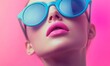 © Александр Михайлюк - A woman with blue sunglasses and pink lips