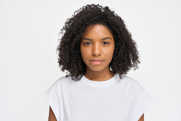 Wall Mural - Portrait of young curly pretty cool generation z African woman wearing t-shirt standing isolated on white background. Confident ethnic Afro American female model looking at camera.