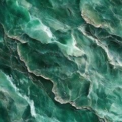 Aerial view of textured green ocean waves and rocky formations.