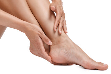 Canvas Print - Woman touching her smooth feet on white background, closeup