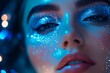 © InfiniteStudio - A close-up of a woman with sparkling blue makeup against a bokeh light backdrop at a glamorous evening event