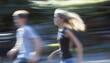 © mai - Use slow shutter speed to capture people walking or running, resulting in blurred bodies that contrast with sharp surroundings, symbolizing the passage of time