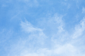 Wall Mural - blue sky background and white clouds soft focus, and copy space horizontal shape.