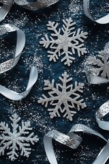 Wall Mural - A blue background with silver snowflakes and white ribbon. The image has a festive and joyful mood, as it is likely meant to represent the holiday season