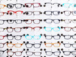 © Cavan Images - Exhibition of glasses in wall rack at optical shop
