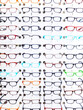 © Cavan Images - Exhibition of glasses in wall rack at optical shop