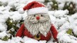 © volga - Handmade santa claus decoration nestled in wintry