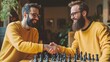 © liliyabatyrova - Two men in yellow sweaters shaking hands while playing chess
