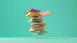 © Rstm - A stack of colorful books floating in mid-air against a turquoise background.
