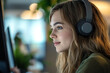 © well - Woman with headphones focused on computer