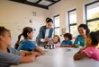 © YiuCheung - A teacher helps a group of students with a science project involving a small toy car.