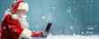 © Александр Марченко - Santa claus using laptop during christmas time