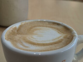 Cup of coffee close view background, breakfast with coffee