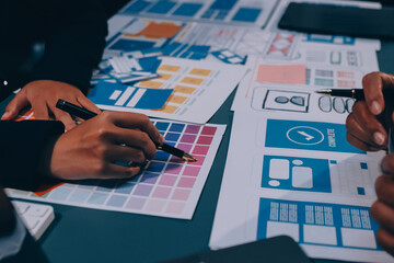 The designer team is designing the uxui system to make the uxui system work well on new phones and support system updates. Website development concept UI UX front end designer